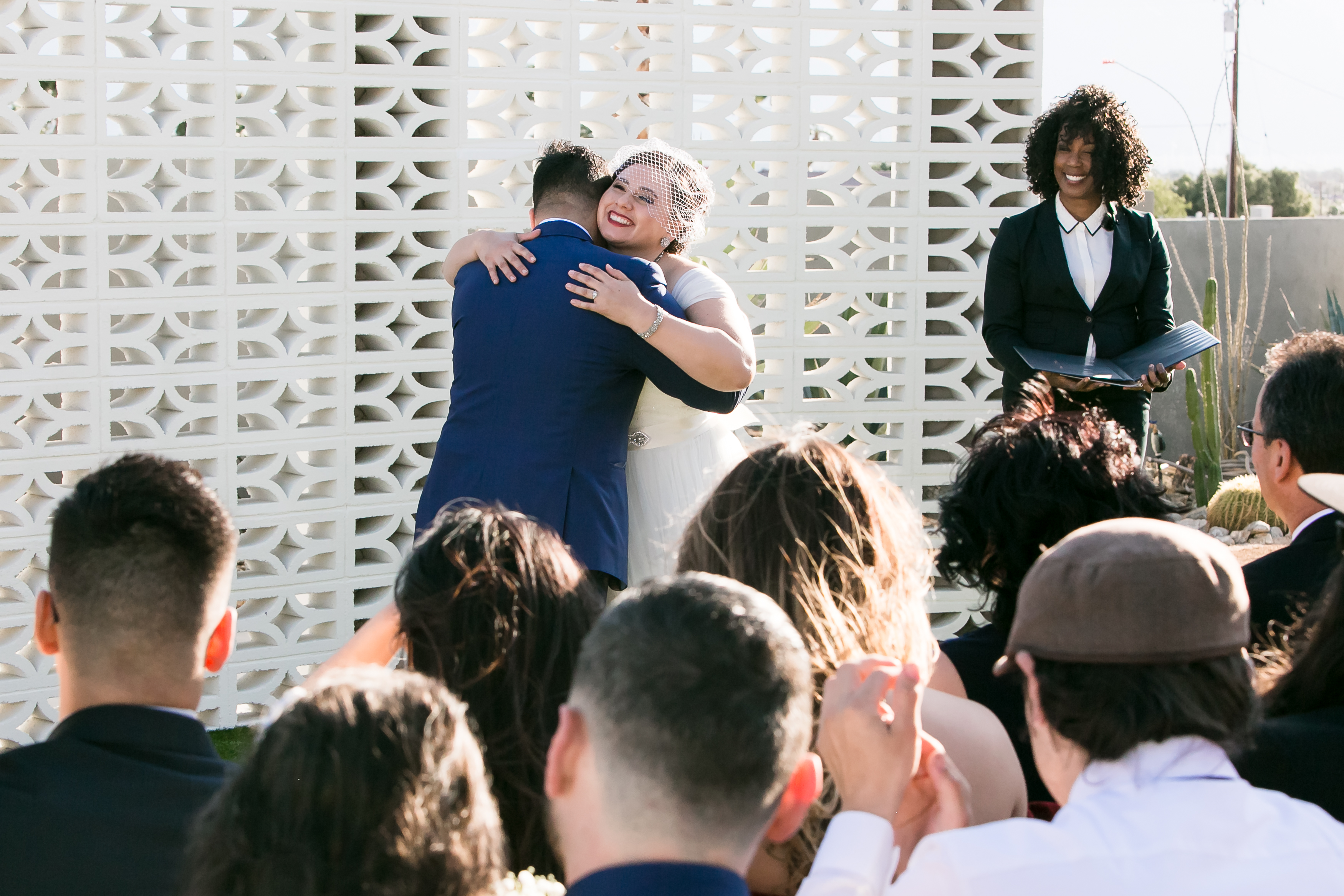 Bride and groom hugging during Desert Hot Springs wedding ceremony