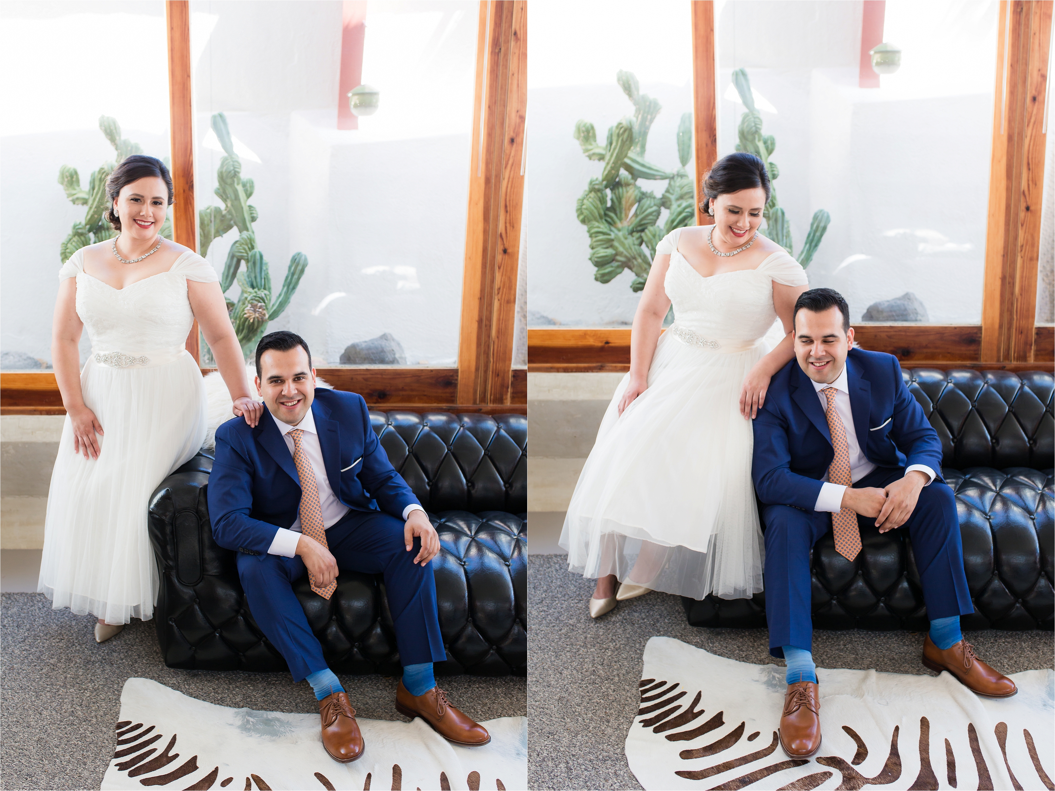 Bride and groom sitting on black leather couch smiling, photographed by Stefani Ciotti