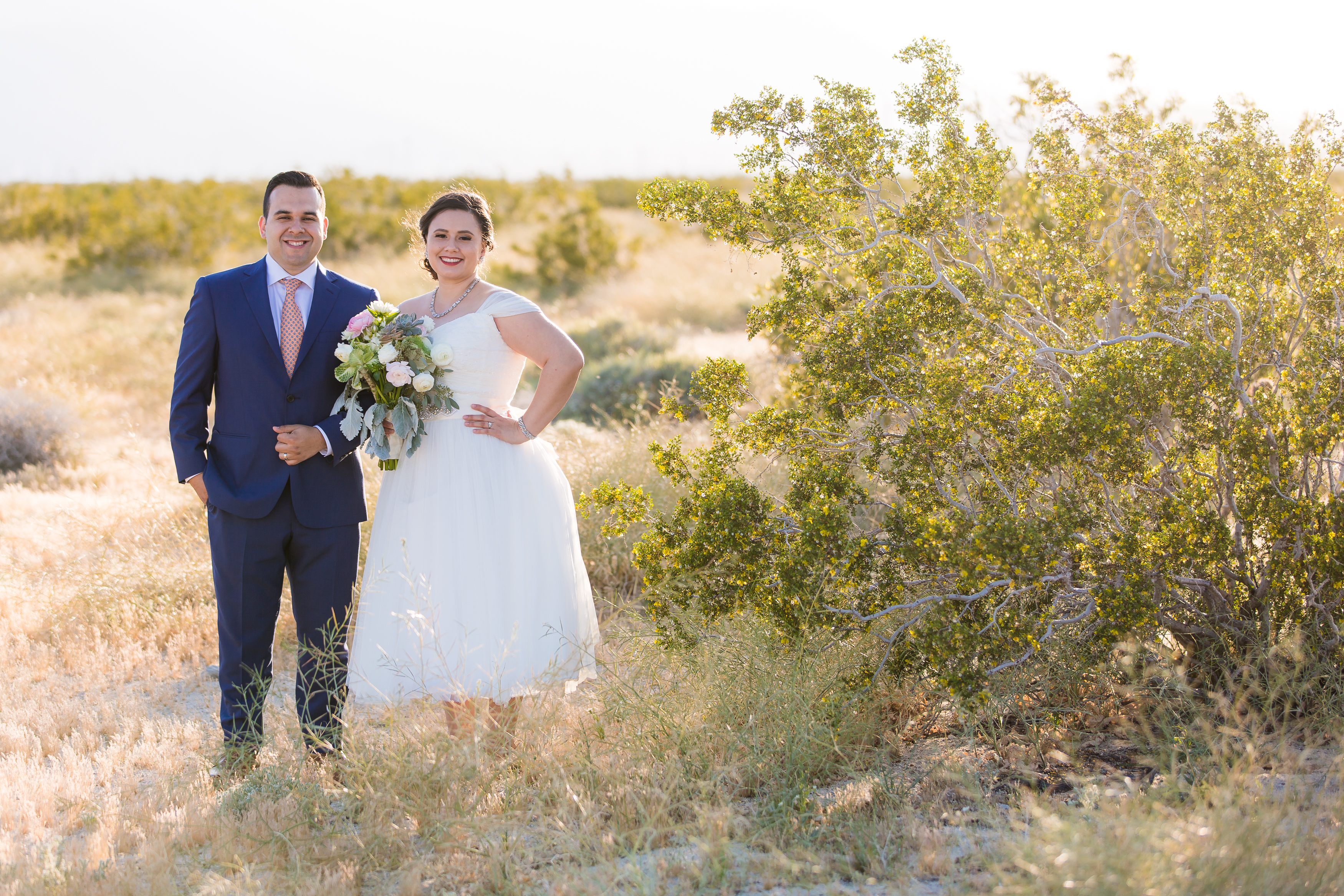 Beautiful wedding couple holding succulent bouquet at The Lautner