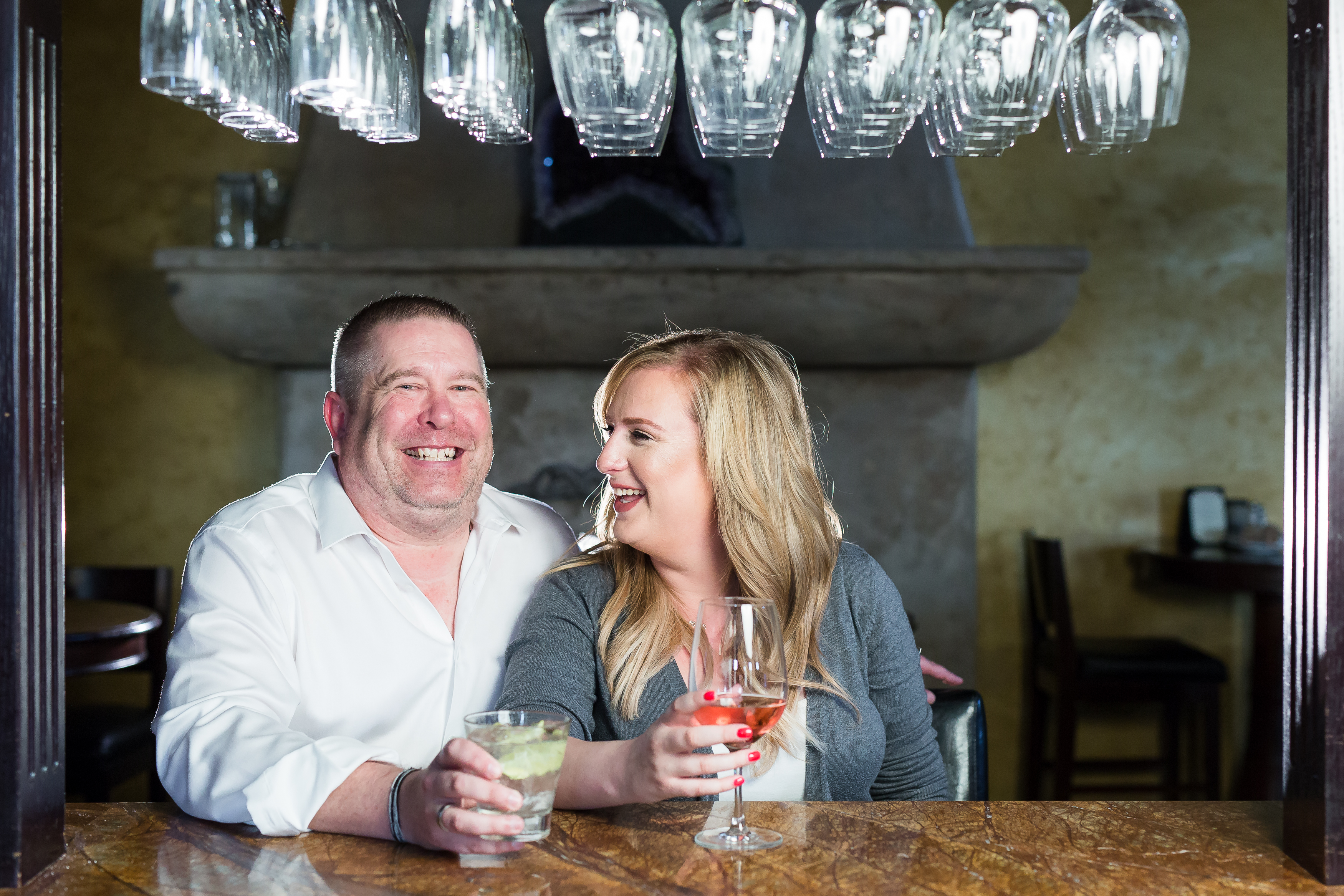 Couple laughing over drinks at a cafe and bar in Moorpark