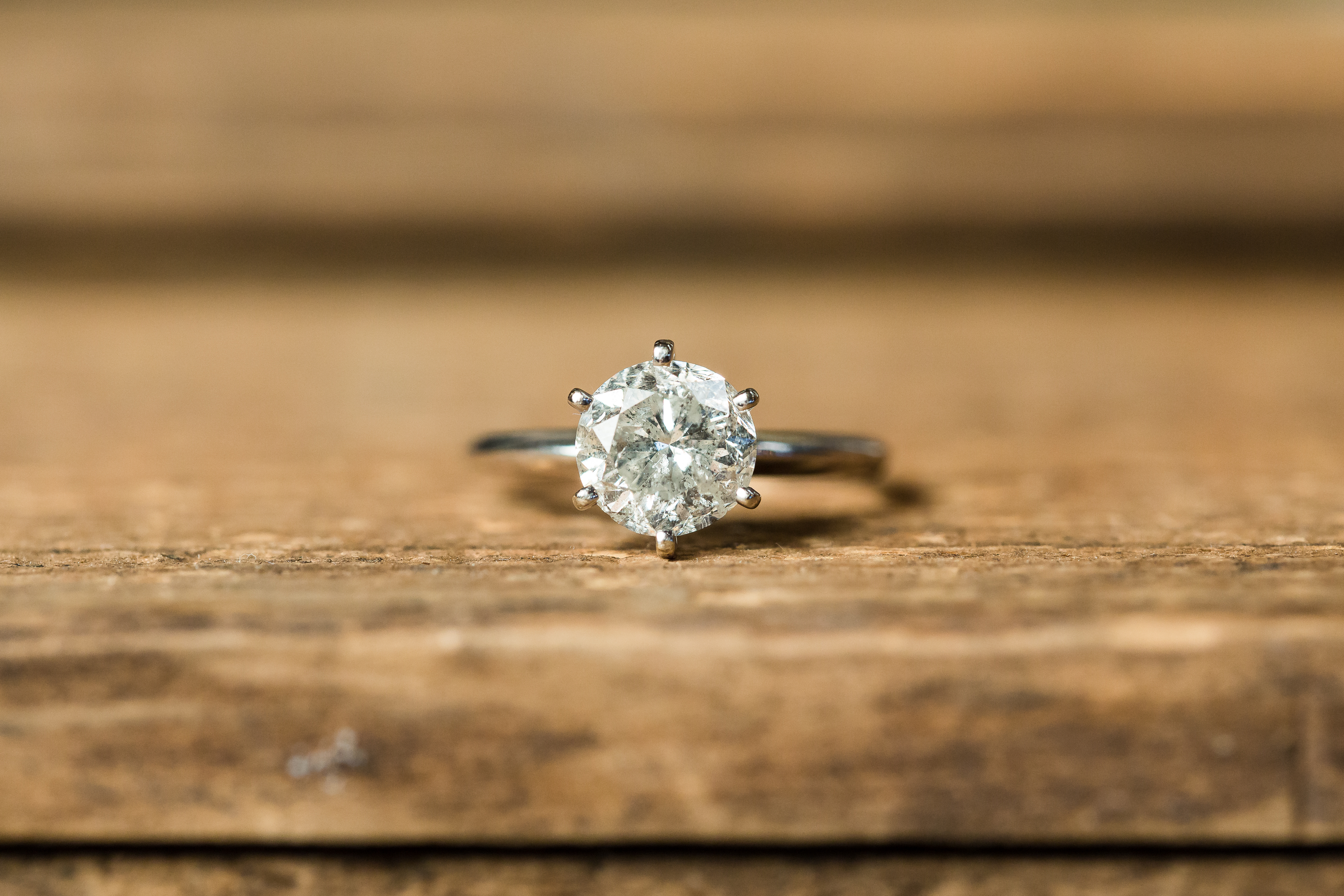 Engagement diamond ring on wooden table