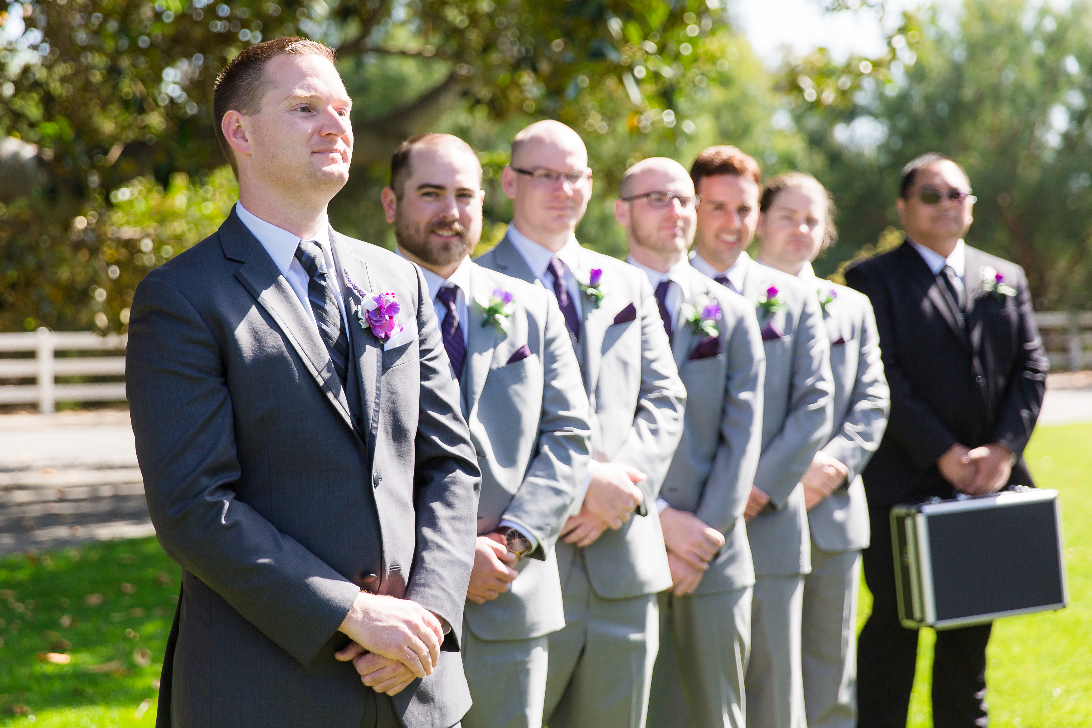 Groom looks emotionally at bride as she walks down the aisle