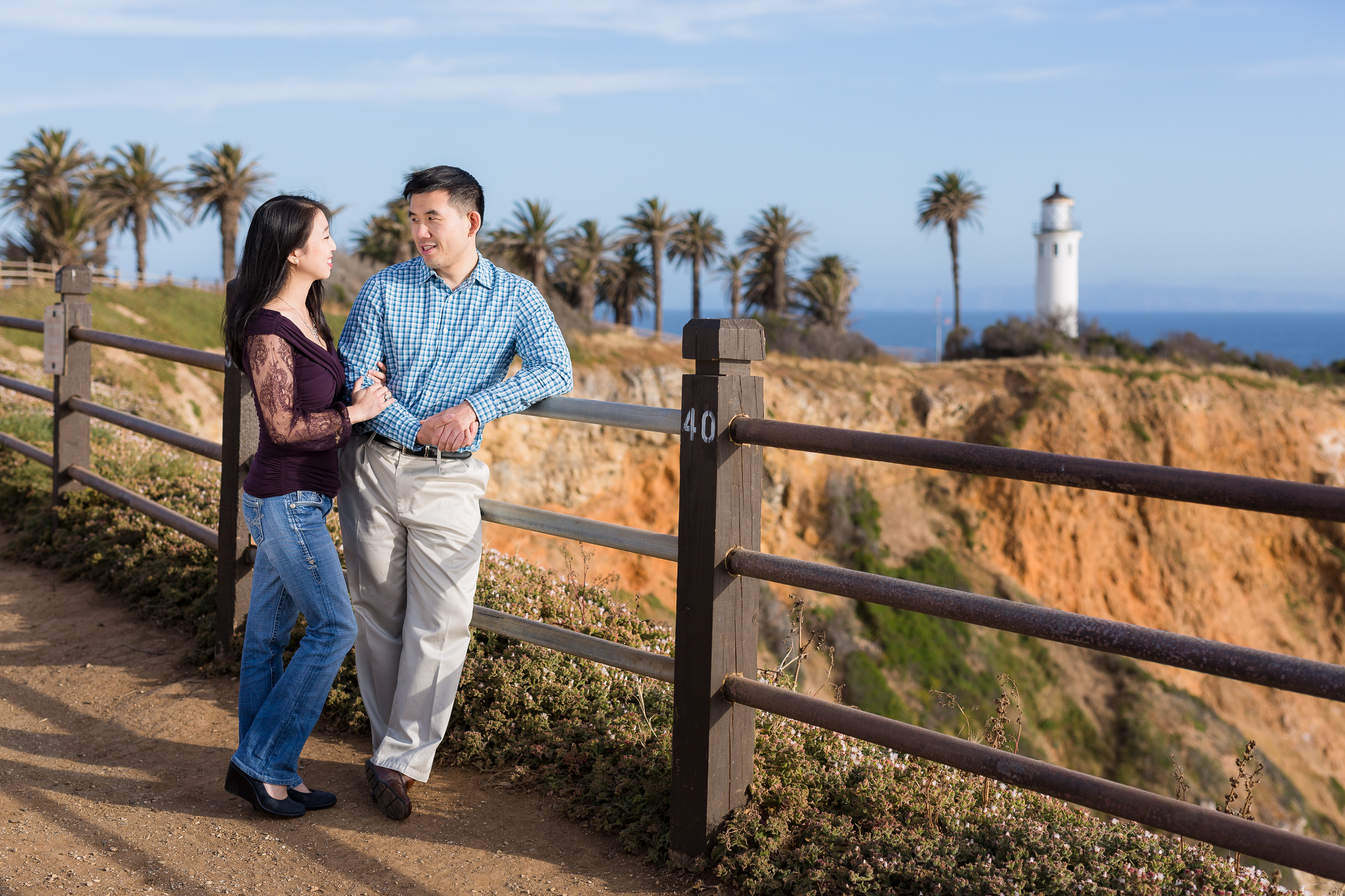 Couple gazing at each other sweetly in Palos Verdes by Lighthouse