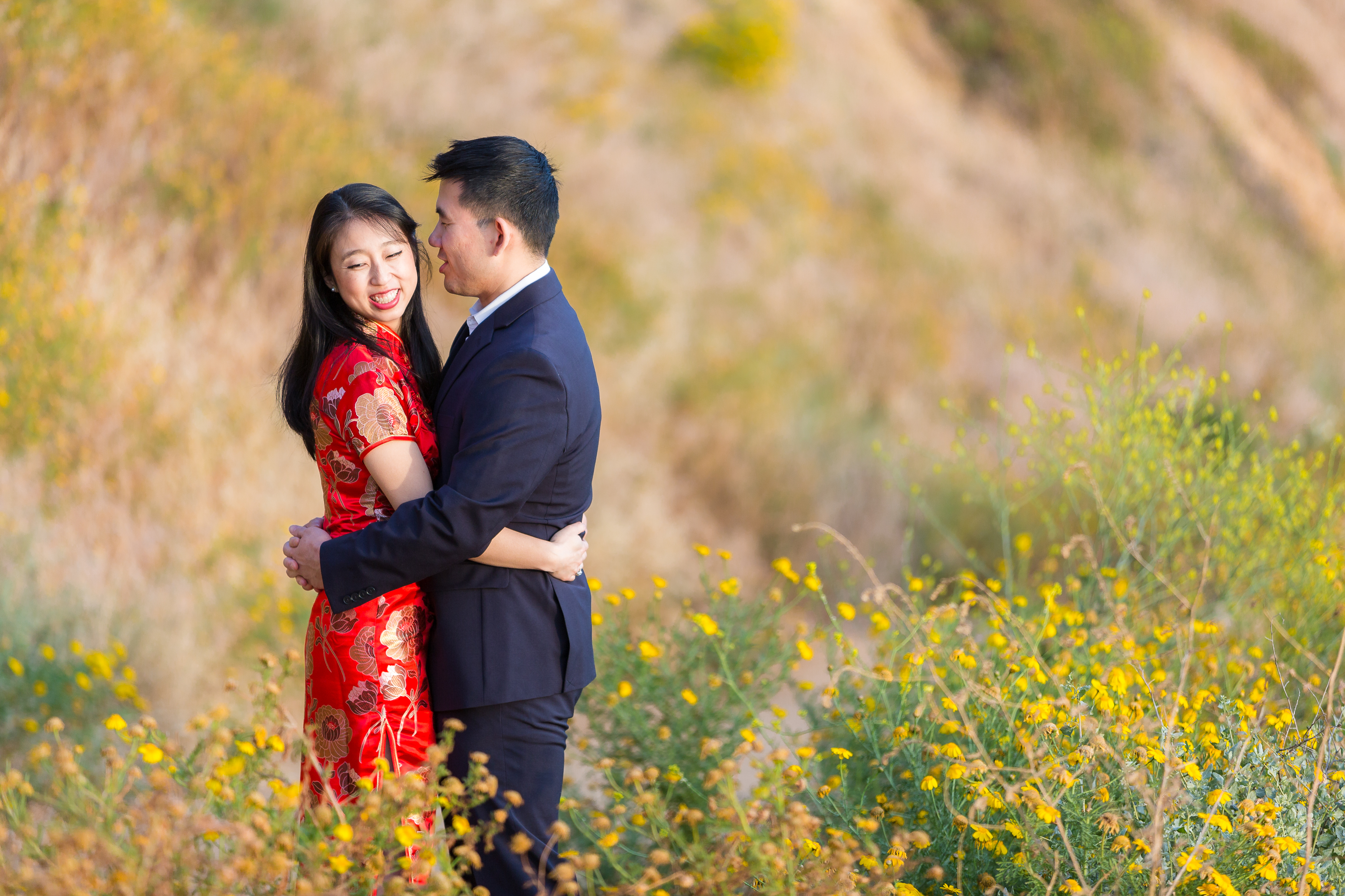 Couple wrapping their arms around each other during their engagement session