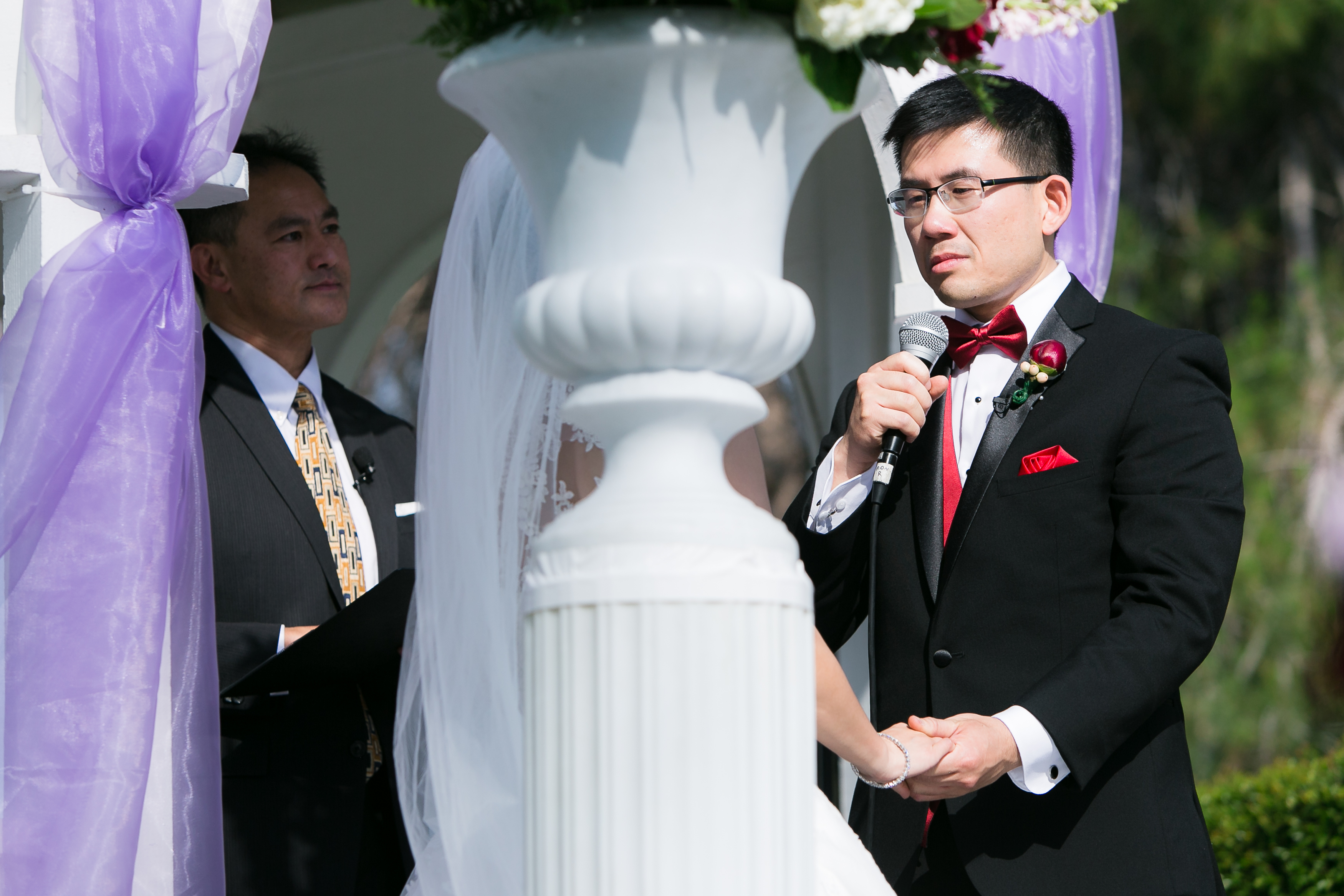 Groom reading vows to bride emotionally