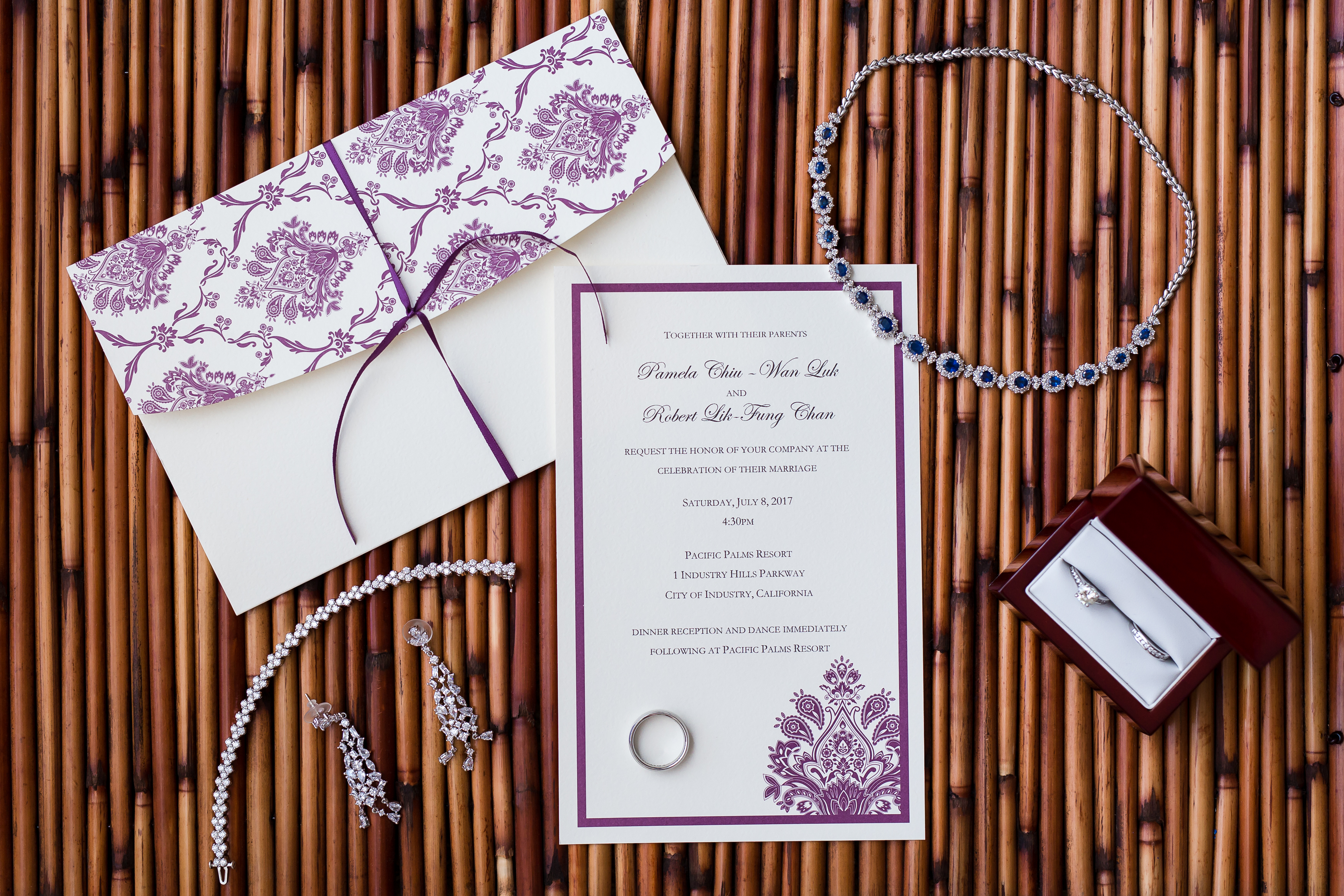 Bridal stationery, necklace, earrings, bracelet and wedding rings Pacific Palms Resort Wedding