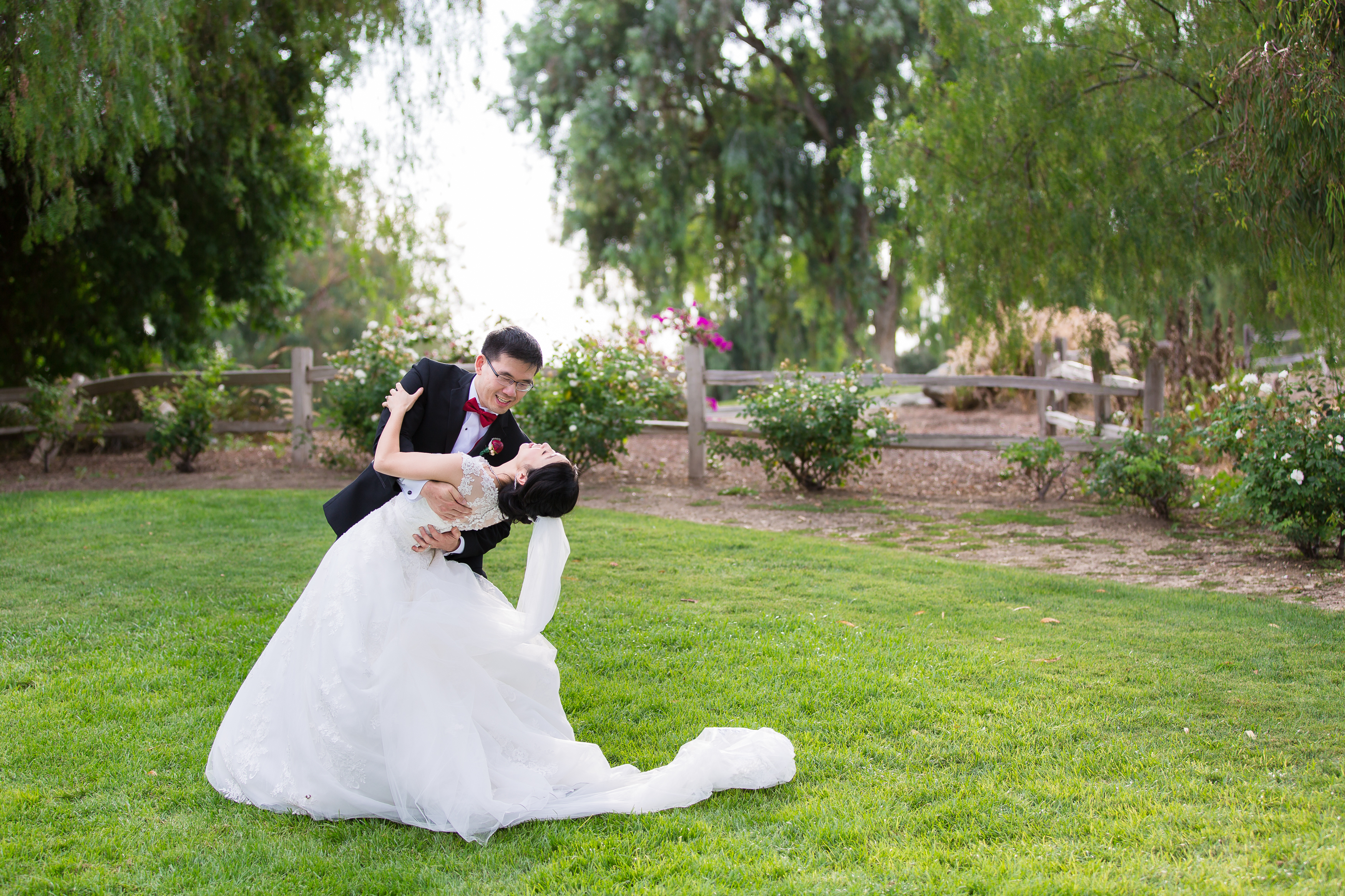 Bride and groom dancing on lawn at Pacific Palms Resort Wedding