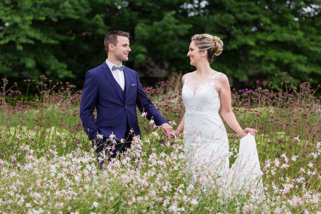 Bride and groom in flower field