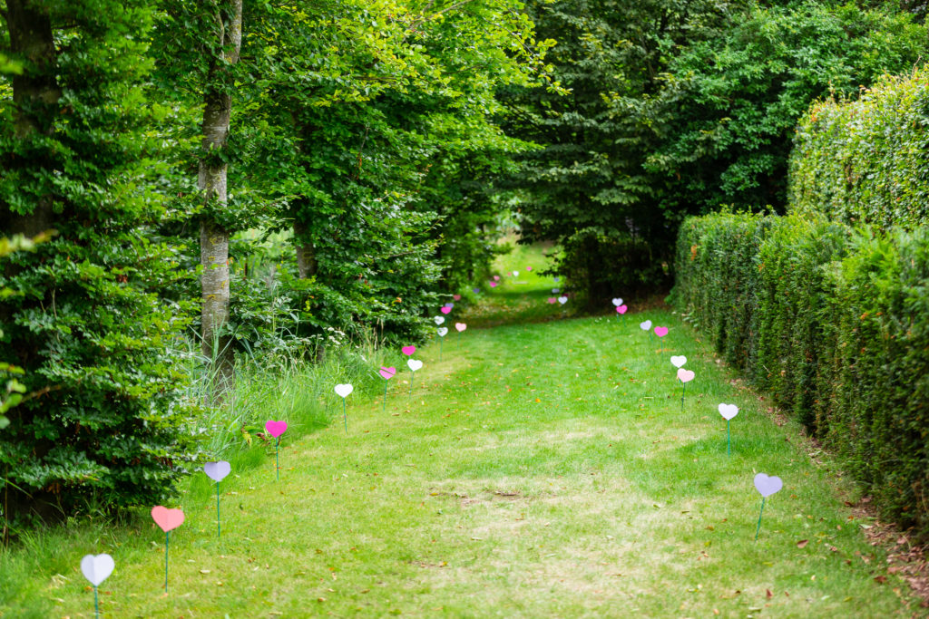 Belgium Garden Wedding walkway decorated with hearts