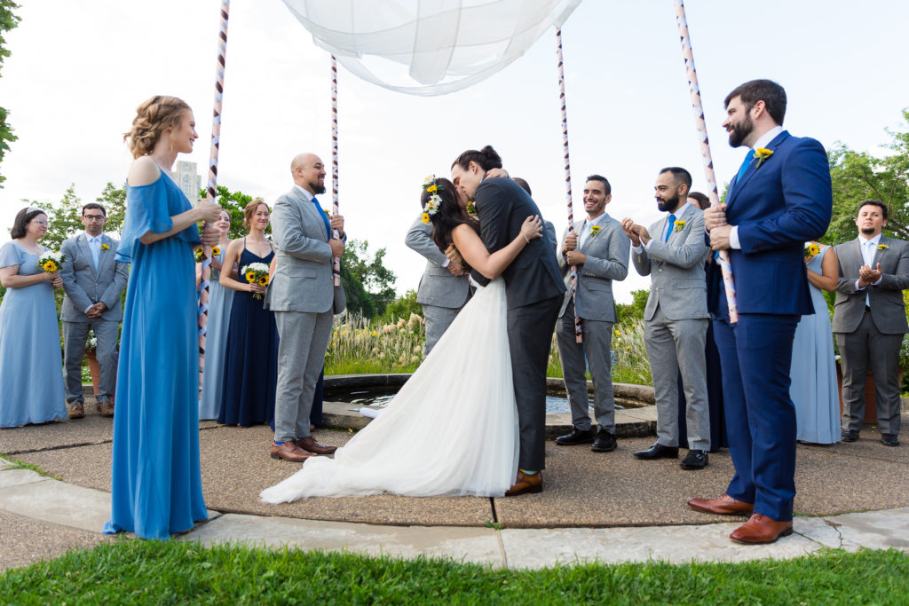 Phipps Conservatory Wedding groom kissing bride after ceremony