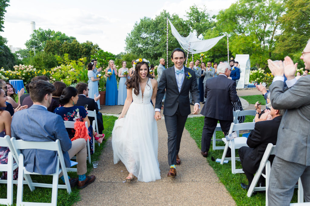 Bride and groom walking down the aisle after ceremony at Phipps Conservatory Wedding 