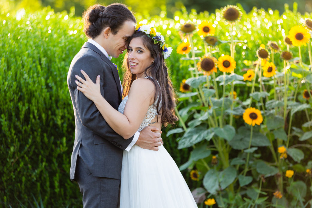 Phipps Conservatory Wedding bride and groom next to sunflower field