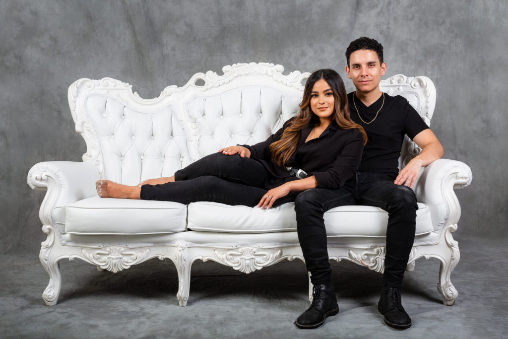 engagement session couple on a white sofa