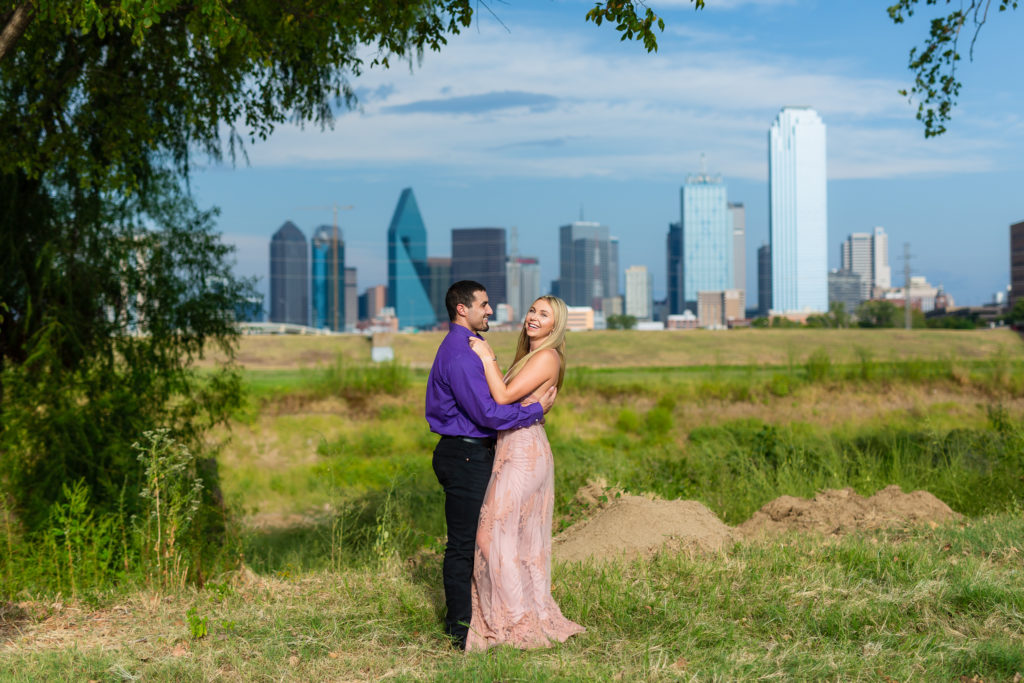 Happy couple with Dallas skyline in background