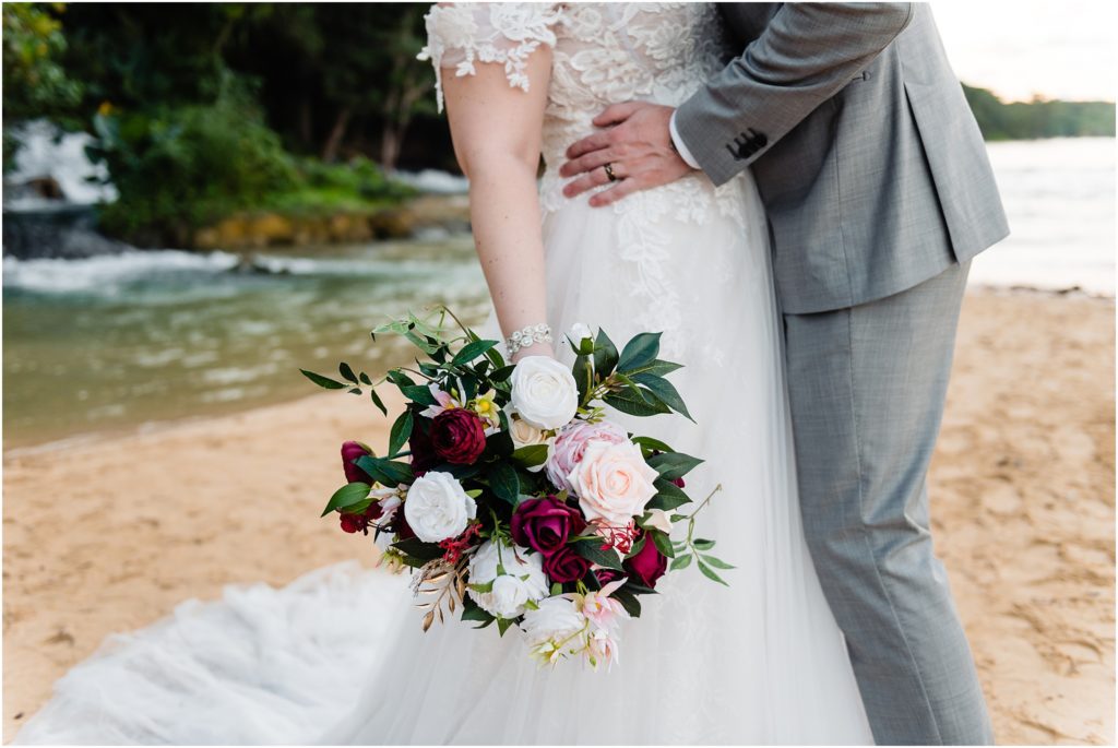 dallas wedding photographer captures detail shot of brides bouquet and skirt of her gown 