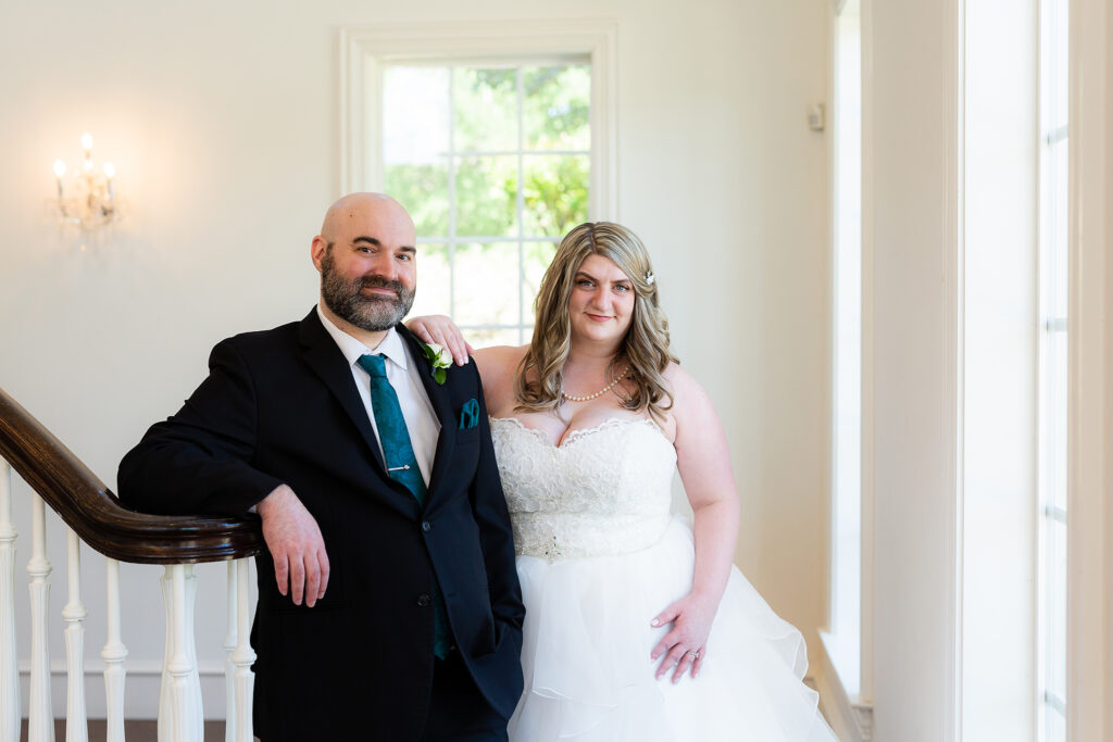 Bride posing with groom at Milestone Denton wedding venue in Dallas Texas by Stefani Ciotti Photography