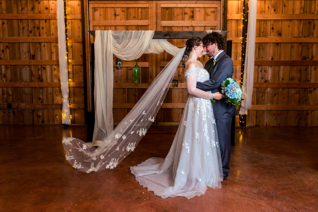 Dallas wedding photographers capture bride and groom hugging