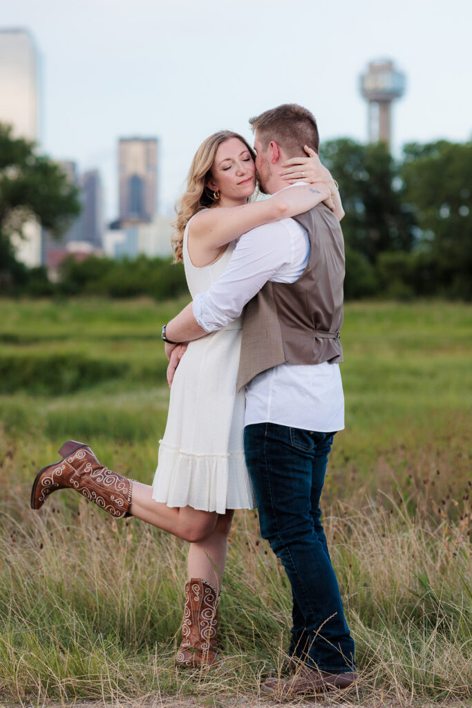Dallas wedding photographers capture man hugging woman during downtown Dallas engagements
