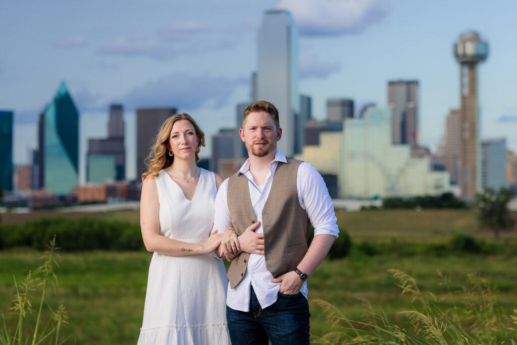 Dallas wedding photographer scp captures couple looking into camera in front of dallas tx skyline
