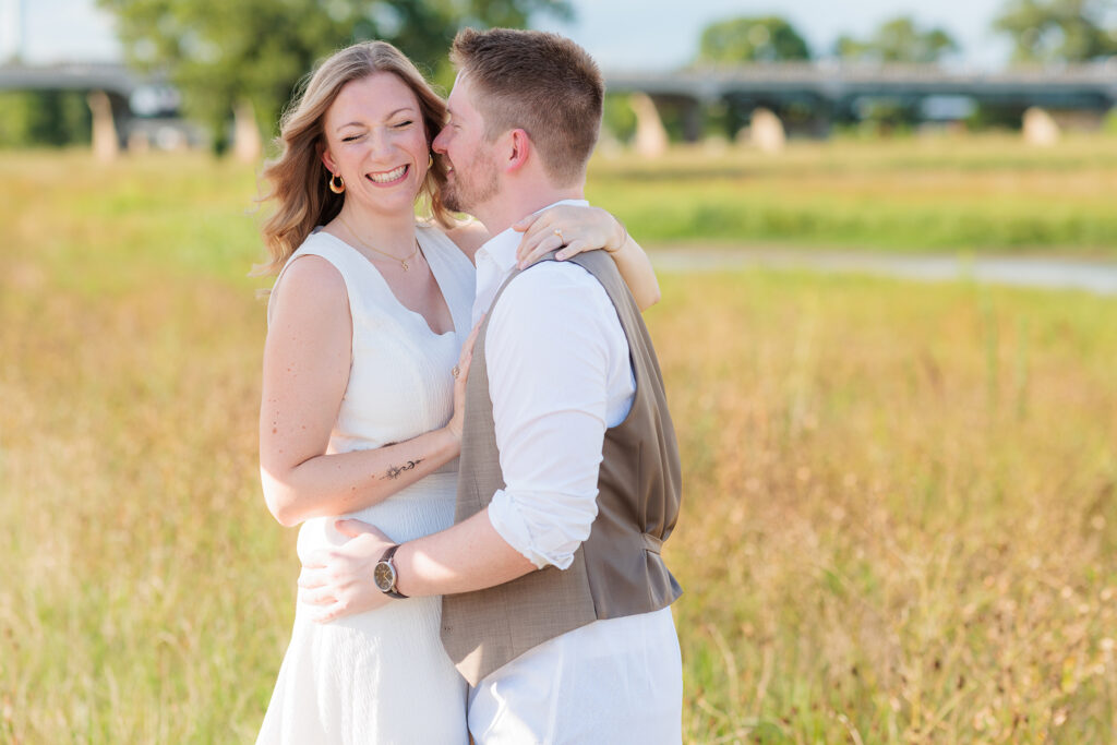 Dallas wedding photographers captures man kissing woman's cheek
