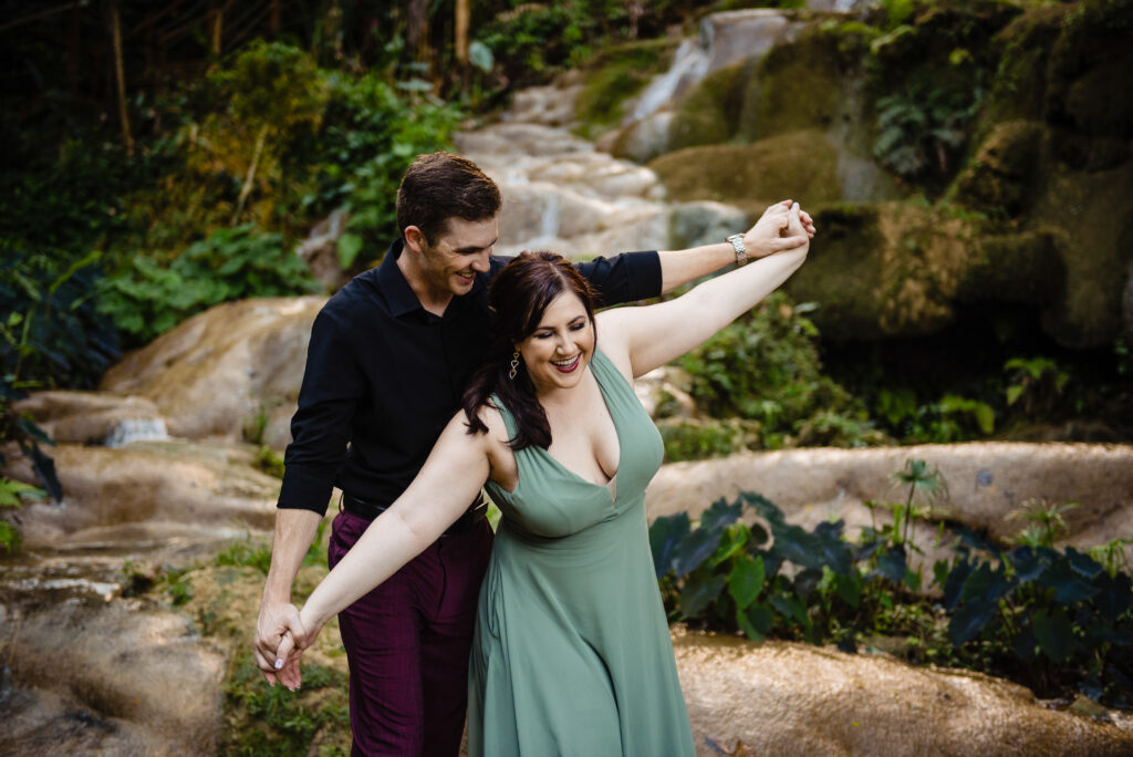 Engagement photo with bride and groom at waterfall at Konoko Falls in Jamaica