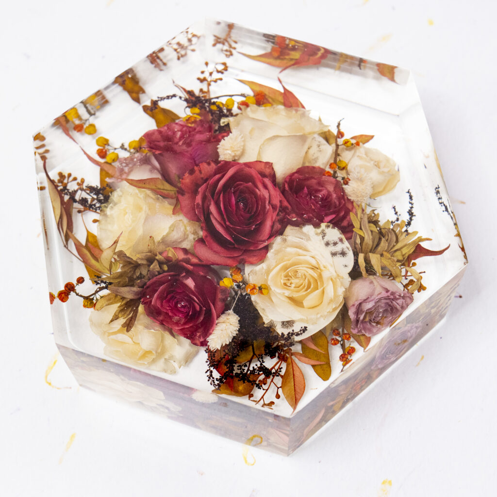 red and white wedding bouquet preserved in resin