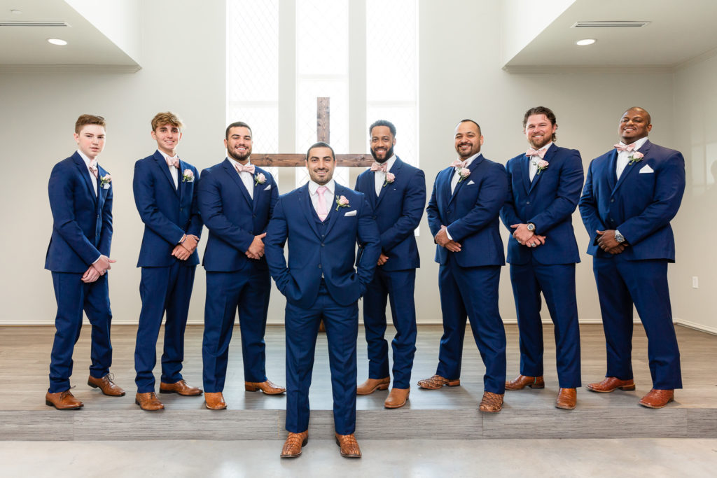 Groom with his best men in blue suits
