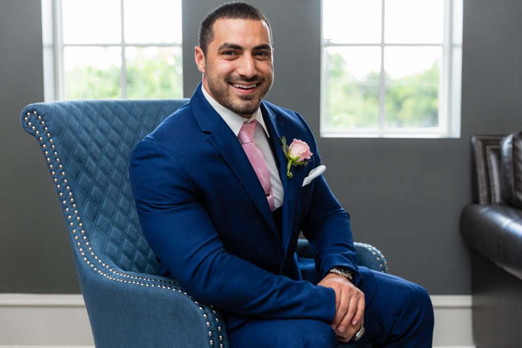 Elegant Montclair Venue Wedding groom in blue suit and pink tie