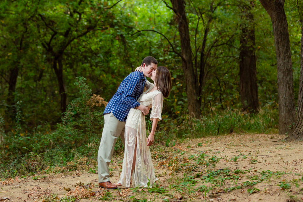 Couple kissing during engagement session in Dallas