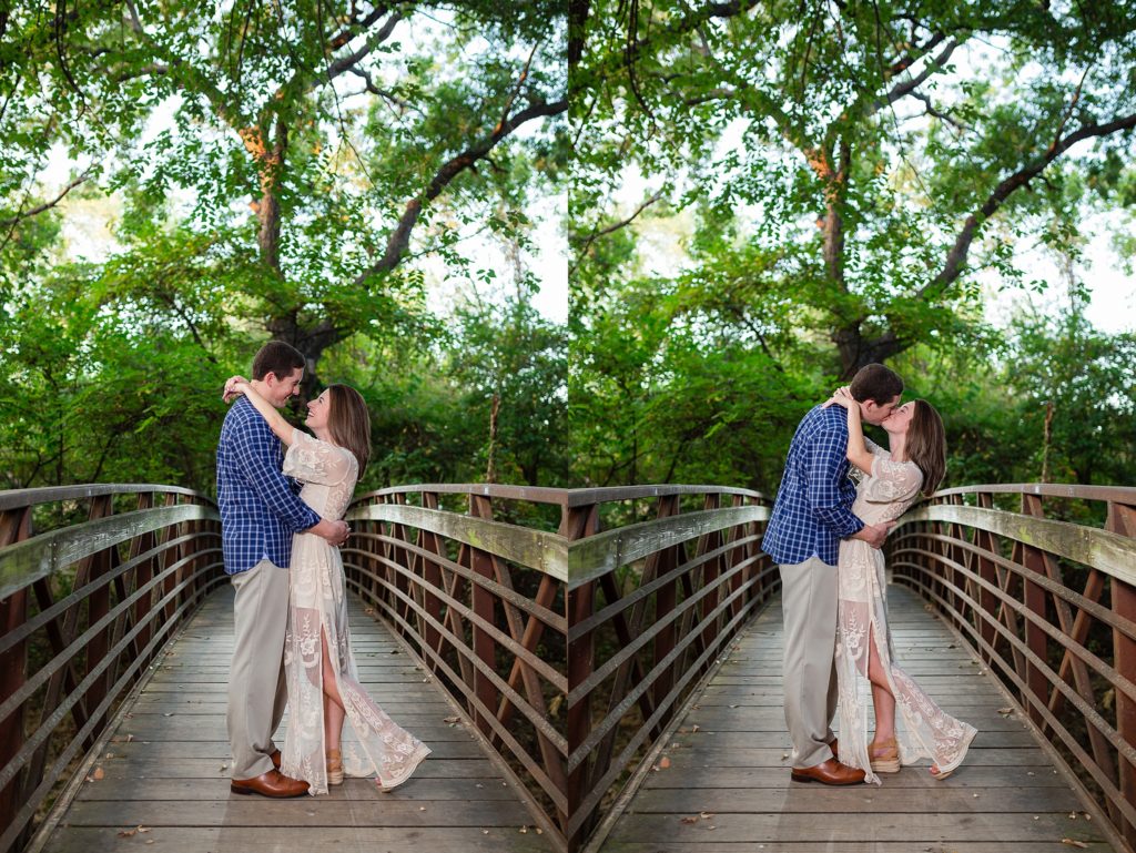 Couple kissing on a wooden bridge 