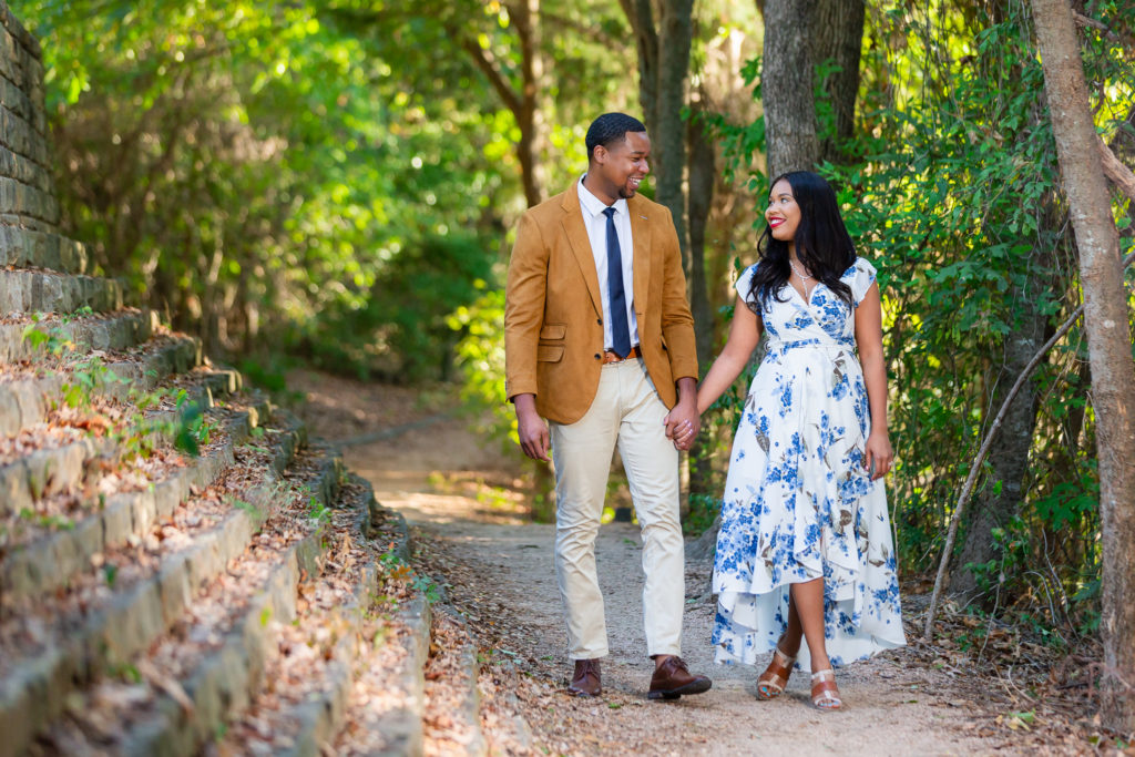 Couple walking among trees during Engagement Photo Session