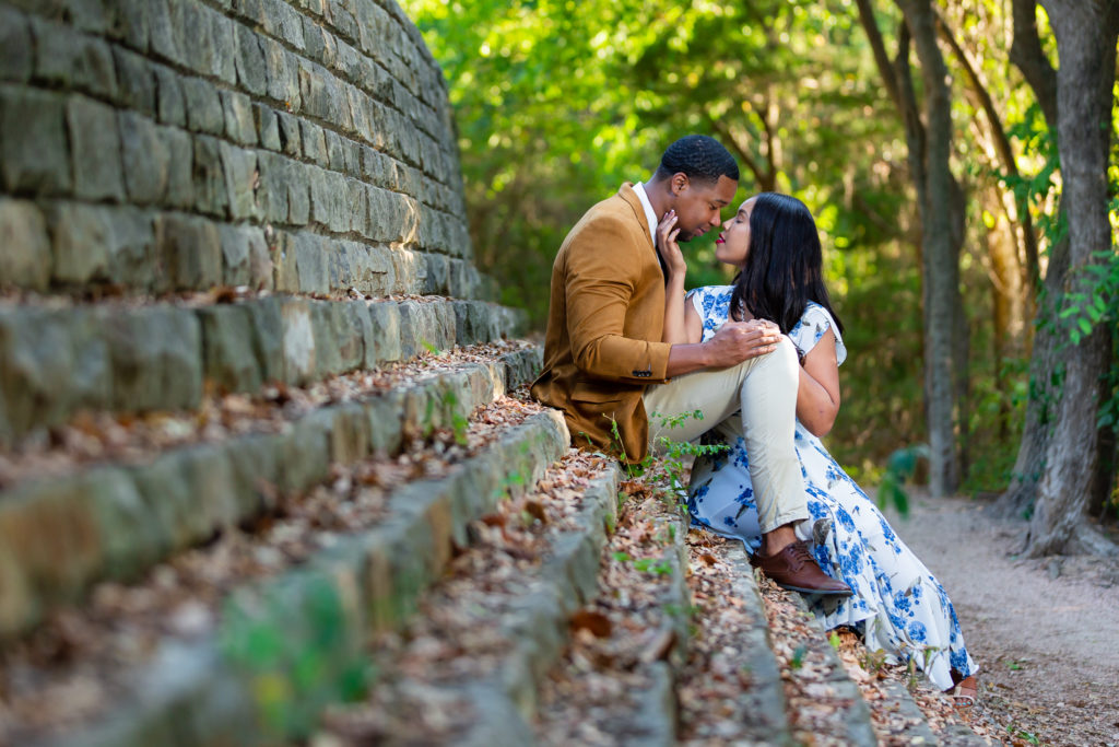 Couple kissing during engagement photo session at Prairie Creek Park in Richardson Tx