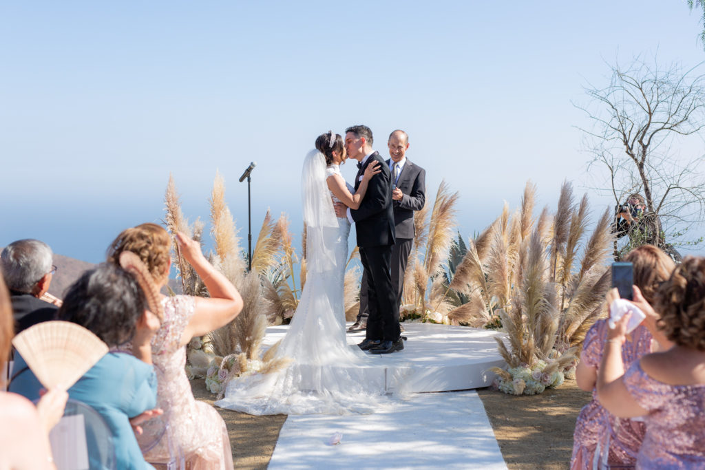 Malibu Estate Wedding groom kissing the bride