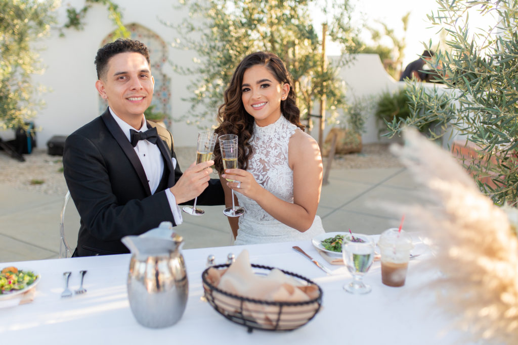 Malibu Estate Wedding couple tosting with champagne