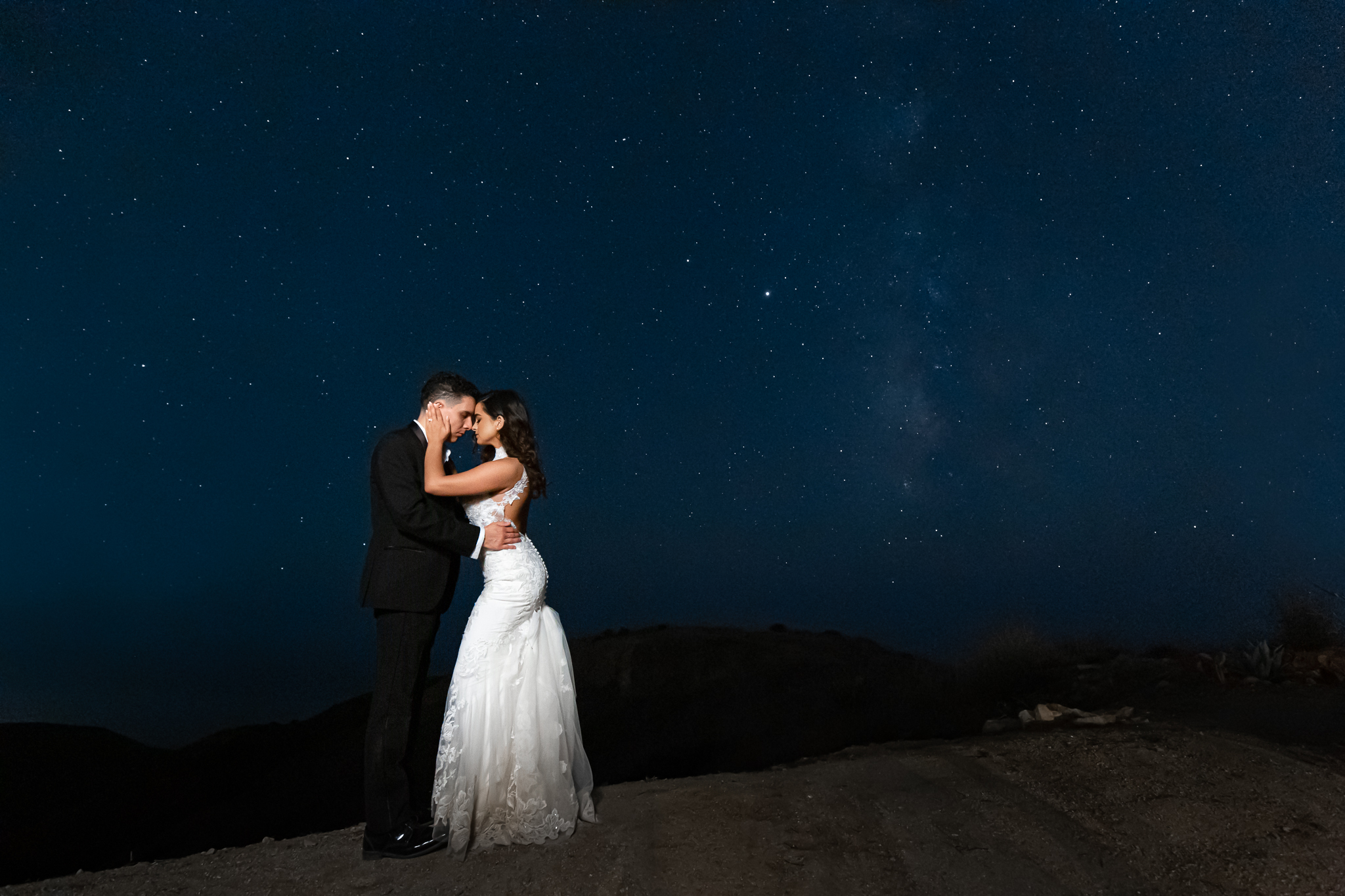 Malibu Estate Wedding bride and groom kissing at night