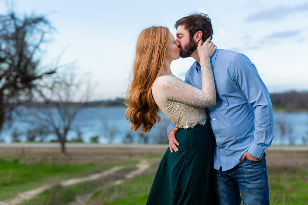 Couple kissing during Dallas engagement session