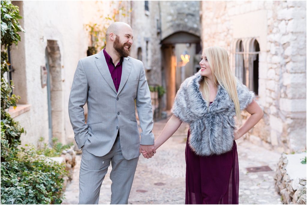 Couple holding hands during engagement photoshoot