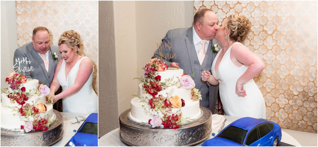 Bride and groom cut their white cake decorated with florals at their luxury wedding venue captured by Dallas wedding photographers