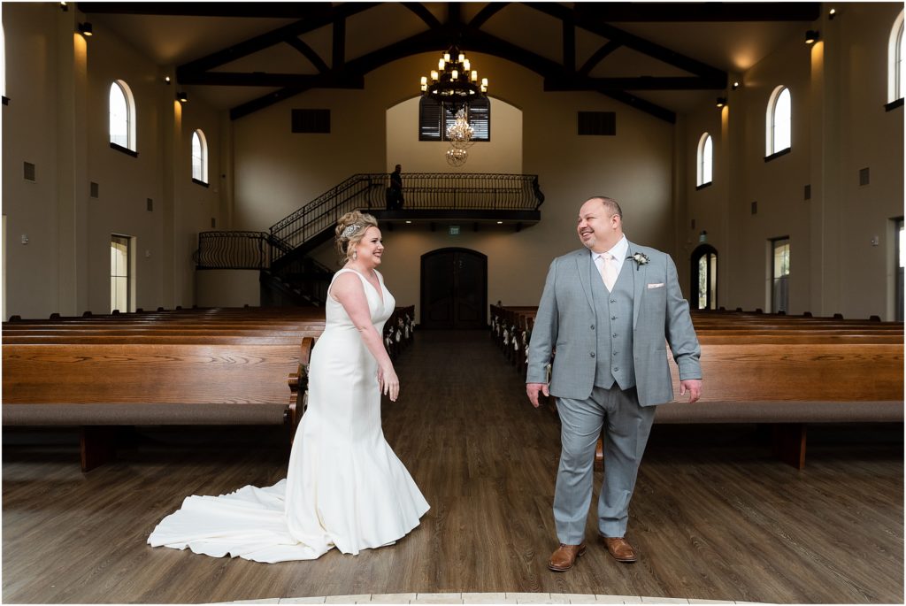 first look in chapel at chapel at ana villa wedding venue captured by Dallas wedding photographers