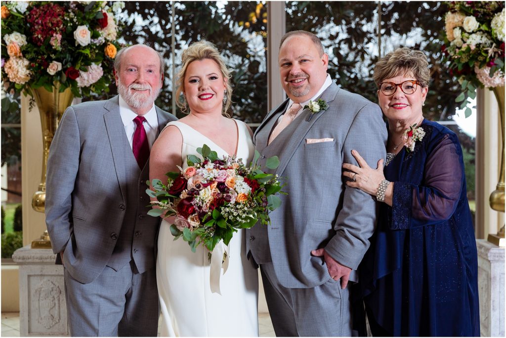 The couple stand with bride's mother and father for Dallas wedding photographers at Ana Villa wedding venue