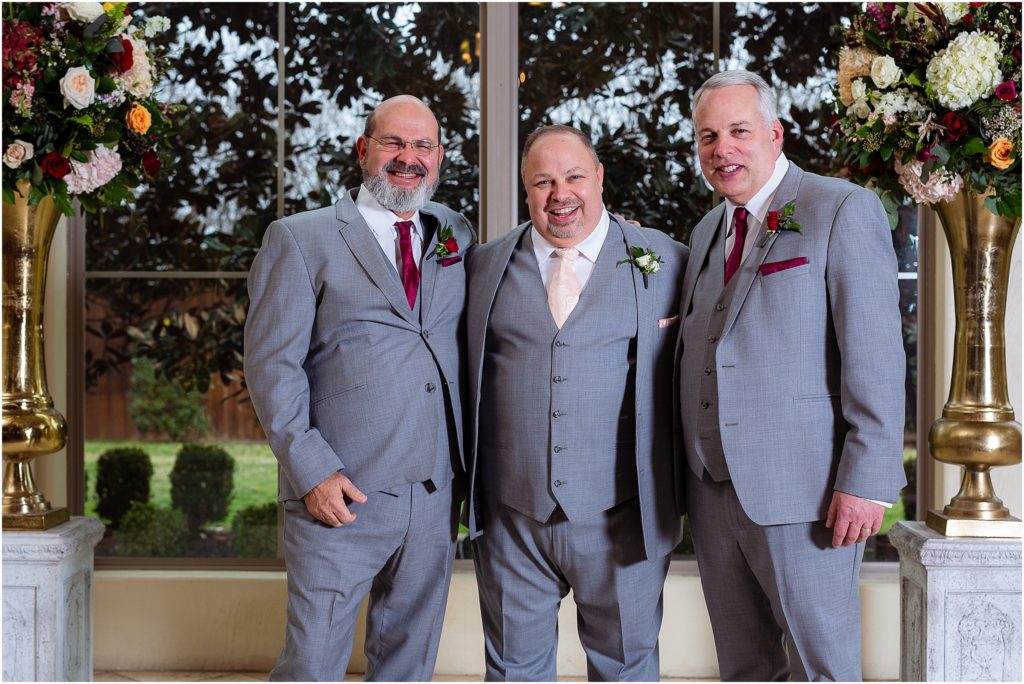 Groom and groomsmen stand for portrait photo by Dallas wedding photographers at Ana Villa wedding venue