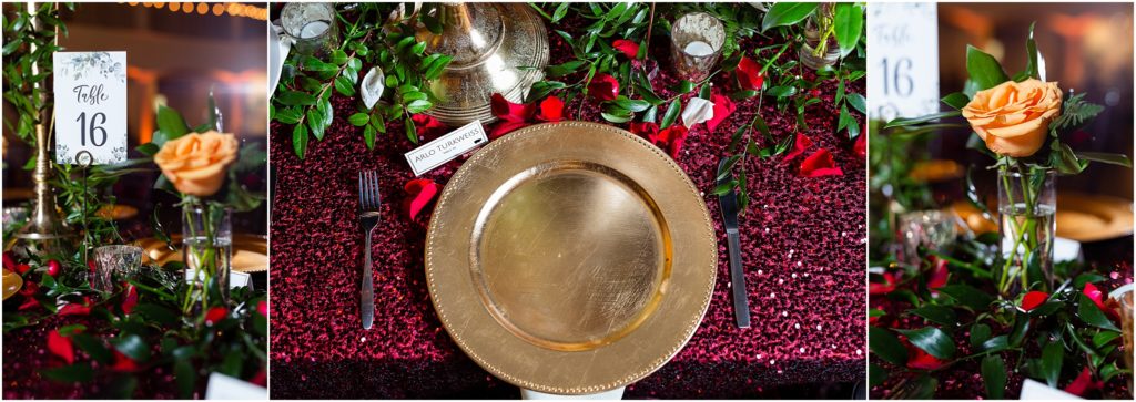 Place settings for luxury dallas wedding venue include gold chargers, orange roses, and glittery maroon table linens photographed by Dallas wedding photographers