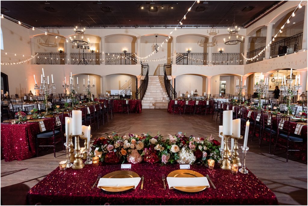 Grand staircase and decorated head table at ana villa grand ballroom in the colony texas captured beforehand by Dallas wedding photographers