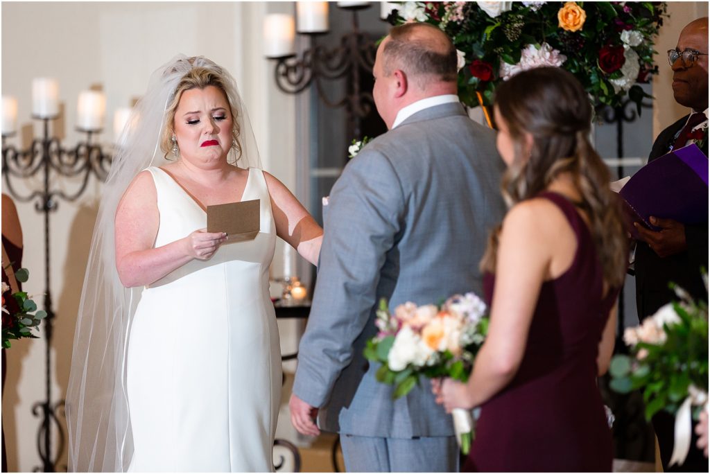 Bride cries as she reads her vows to groom during Ana Villa wedding ceremony photographed by Dallas wedding photographers