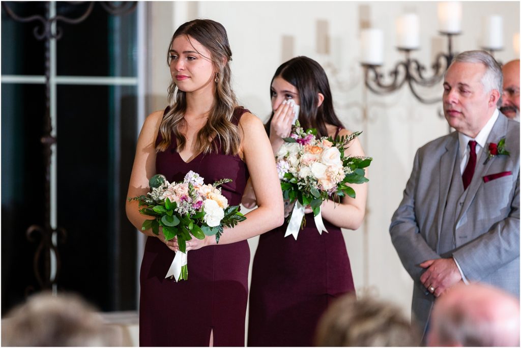 Bridesmaids cry during ceremony of Ana Villa TX wedding captured by Dallas wedding photographers