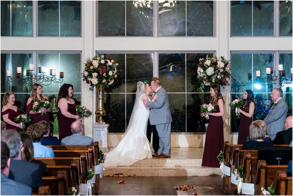 The first kiss after the ceremony of bride and groom in Ana Villa wedding photographed by Dallas wedding photographers