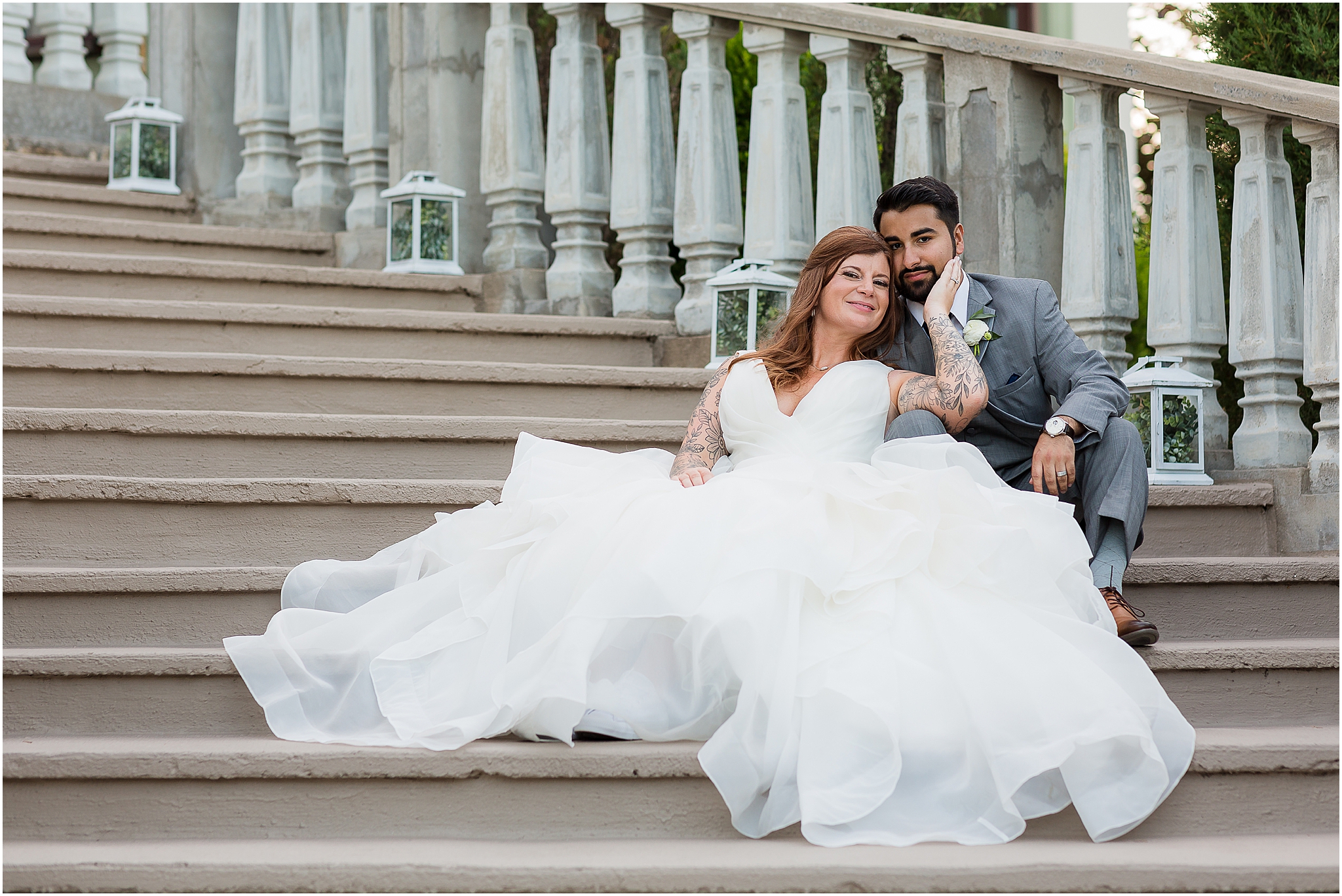 elegant portrait of bride and groom sitting on staircase in wedding attire at stoney ridge