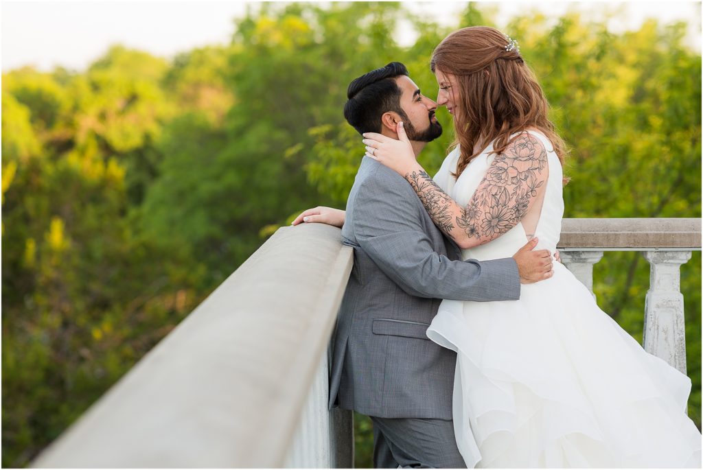 bride and groom nose to nose by Dallas wedding photographers