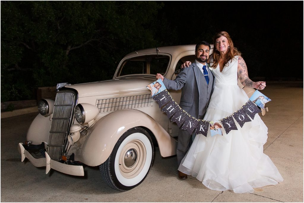 DFW vintage car getaway with bride and groom holding thank you sign