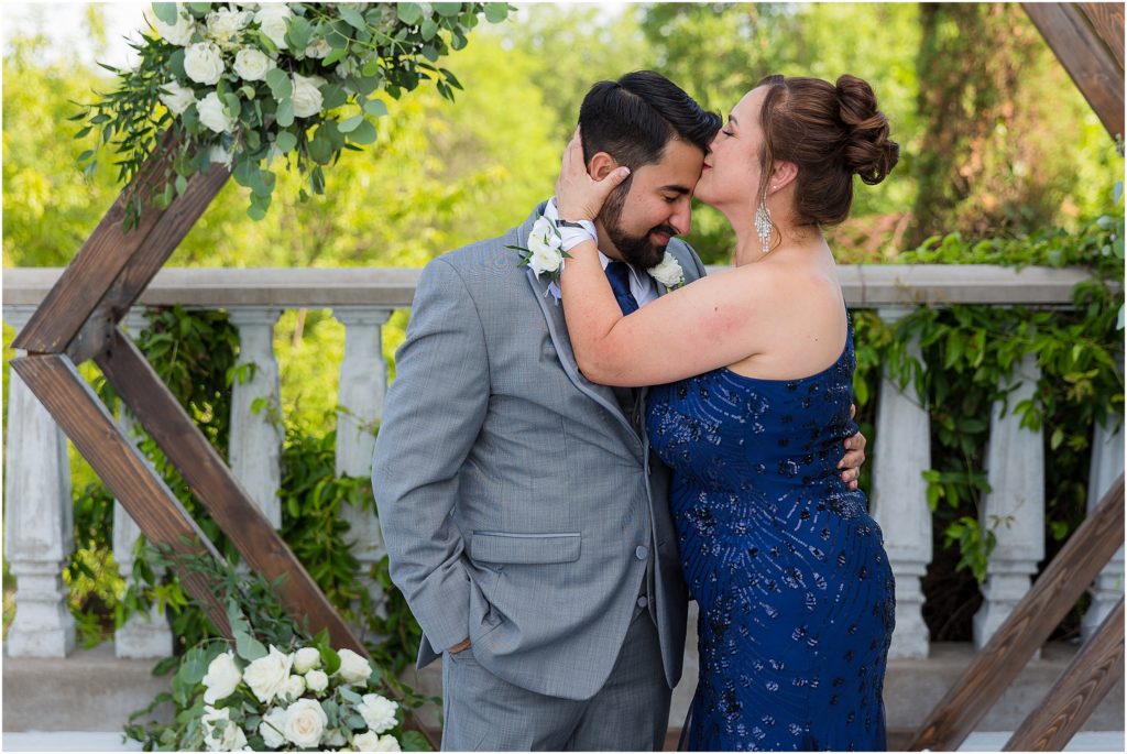 mother kissing groom on head during wedding photographed by Dallas wedding photographers